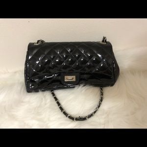 Black patent leather quilted purse.